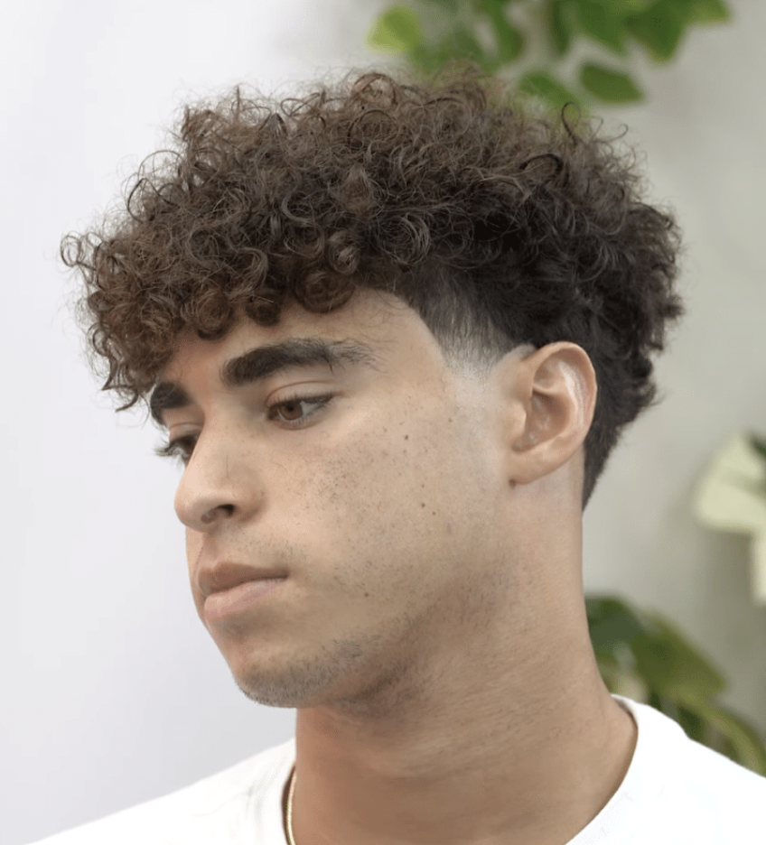 Curly fringe hairstyle for men